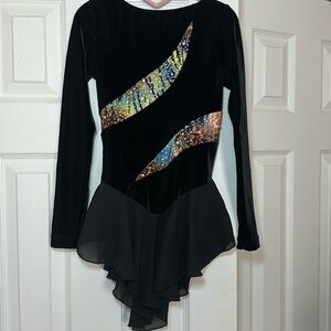 Figure scaring black Leo with skirt and gems